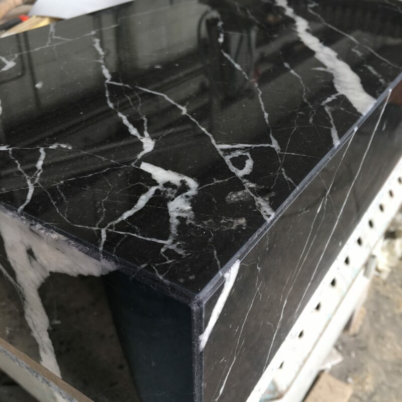 Polished corners of marble sink-top